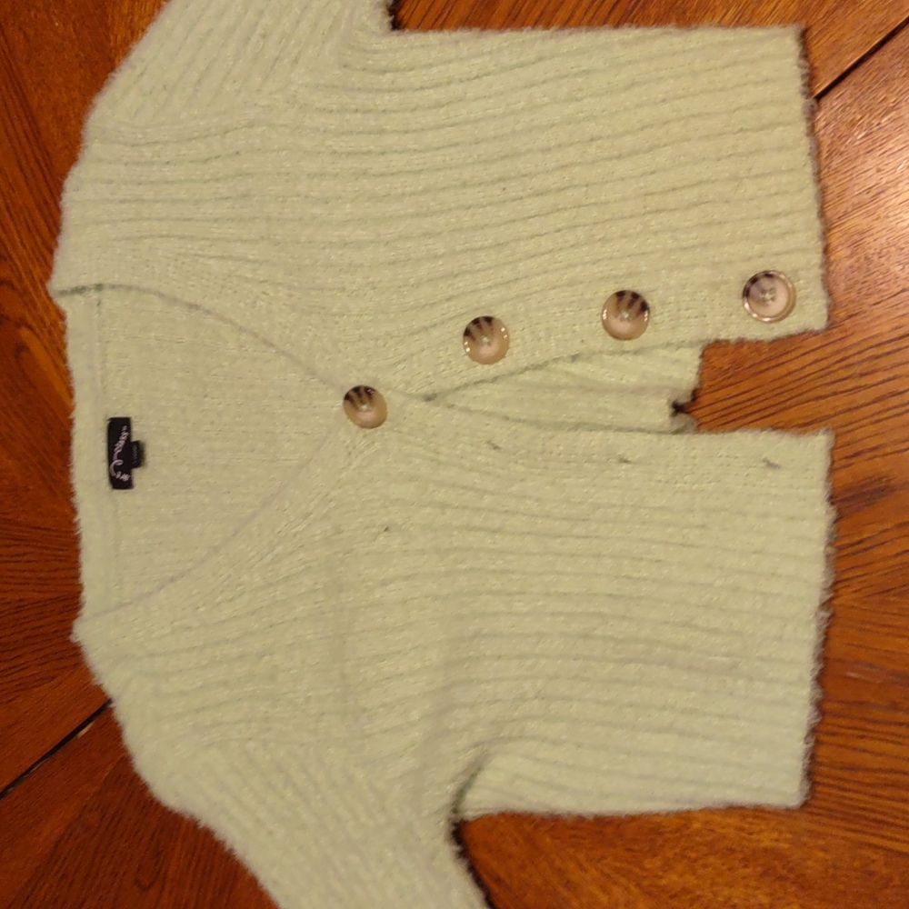 A fuzzy green cropped cardigan